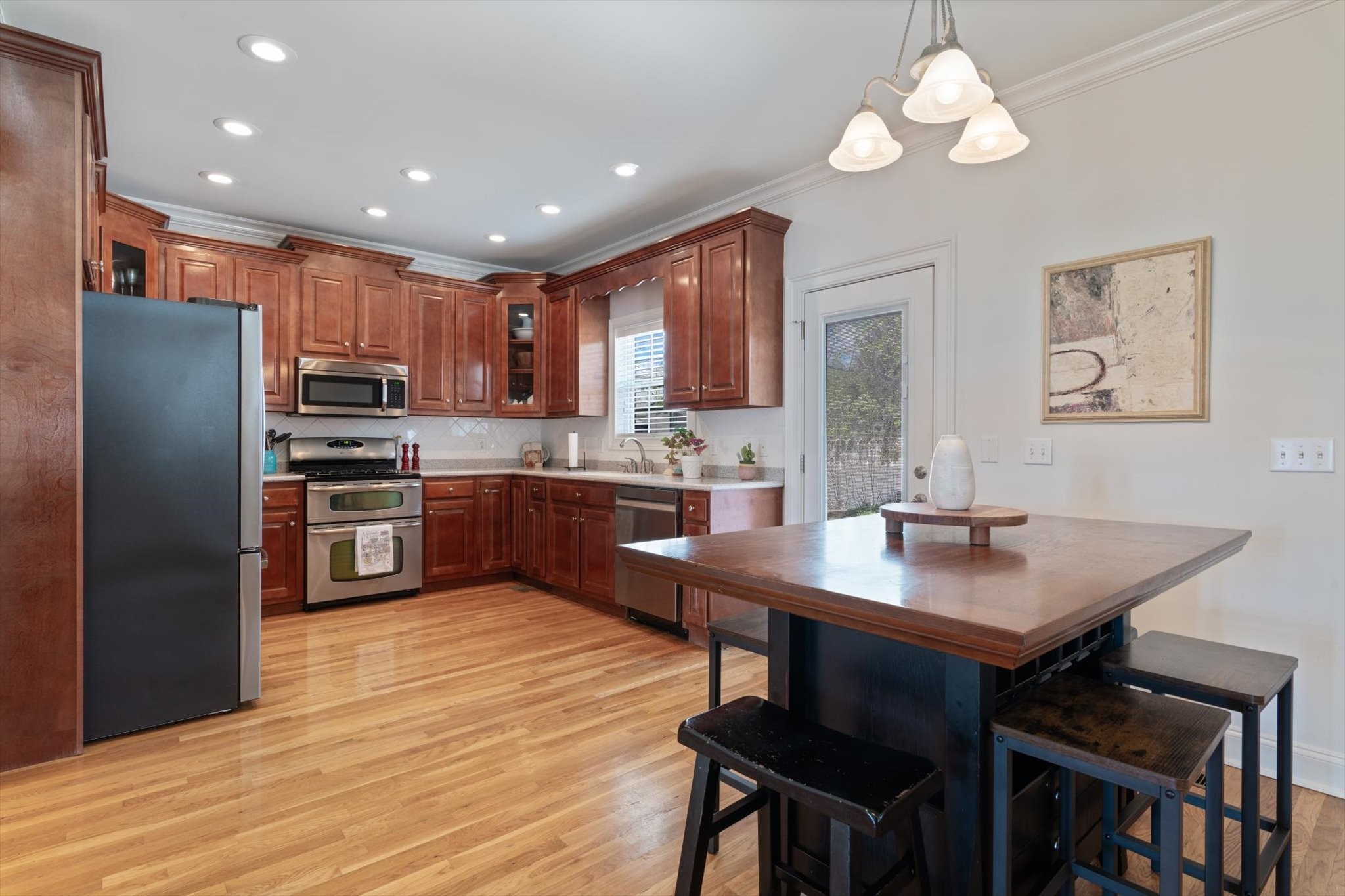 2910 Sulphur Springs Road Murfreesboro, TN 37129 - Photo 20 of 44 a kitchen with stainless steel appliances granite countertop a sink a stove a refrigerator and island