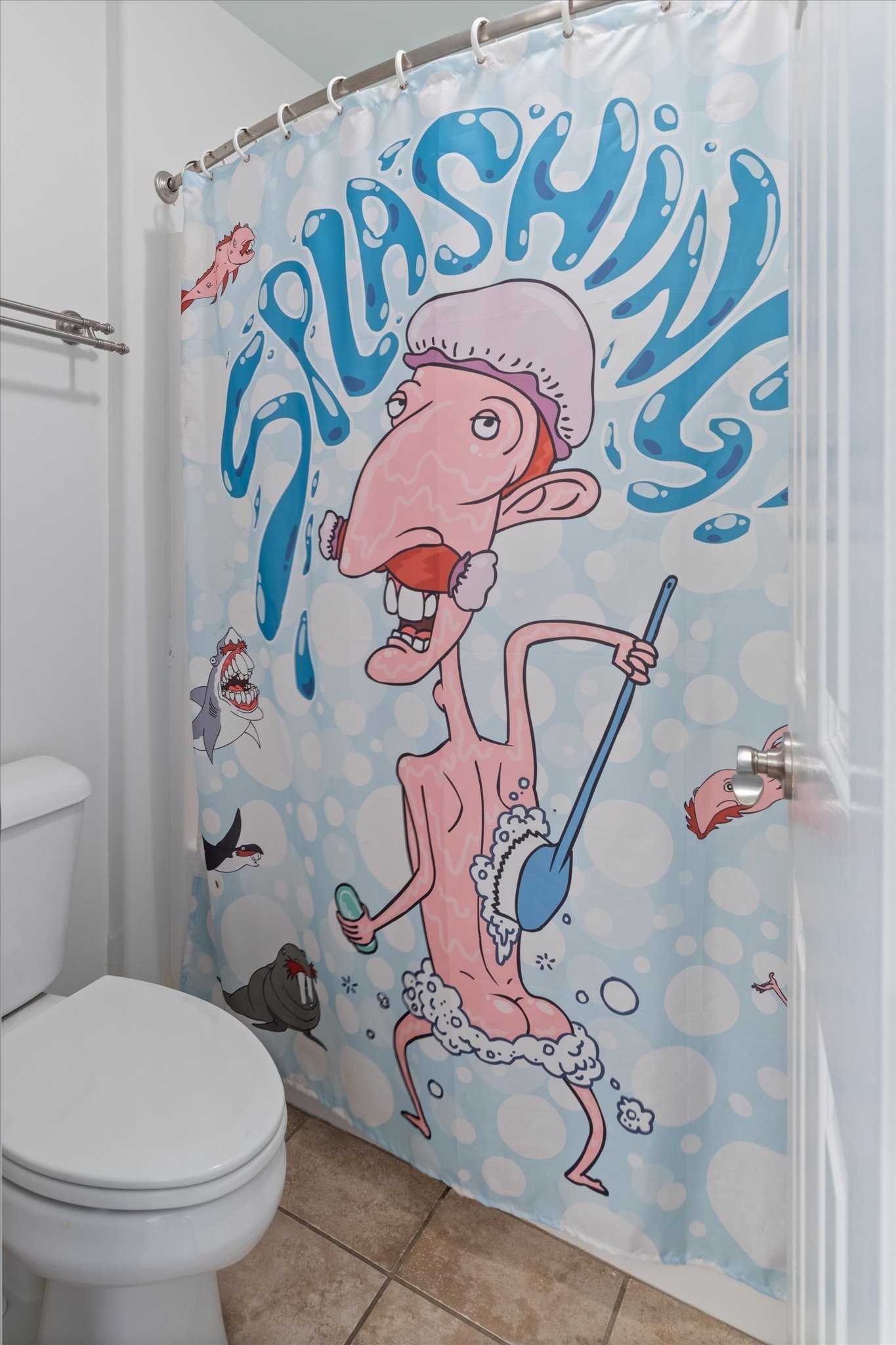 2910 Sulphur Springs Road Murfreesboro, TN 37129 - Photo 39 of 44 a white toilet sitting next to a shower curtain