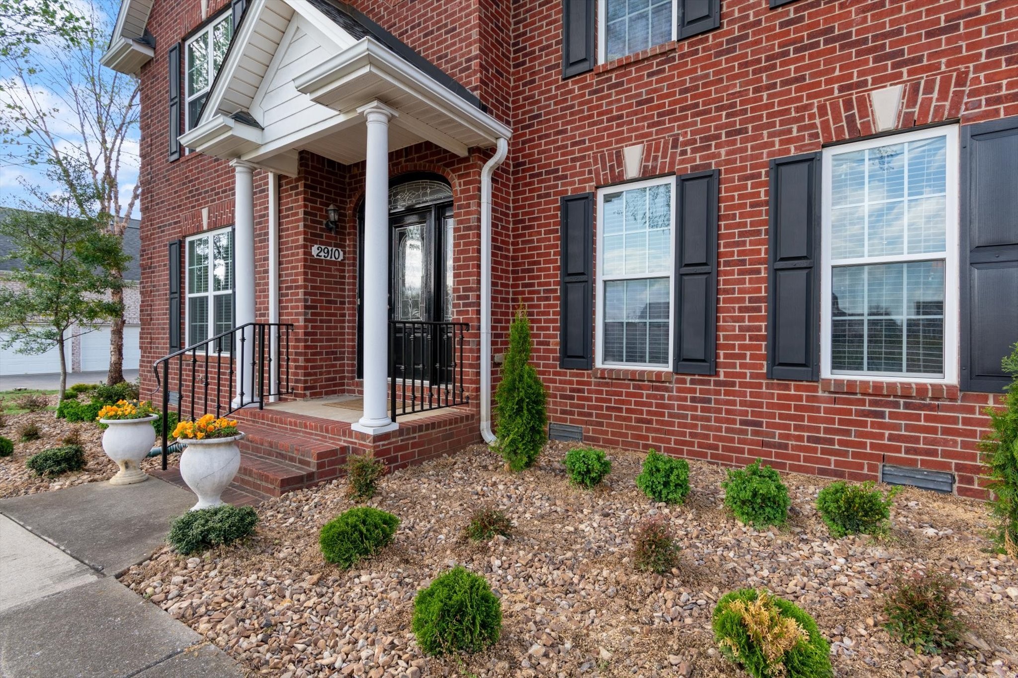2910 Sulphur Springs Road Murfreesboro, TN 37129 - Photo 4 of 44 a front view of a house with outdoor seating