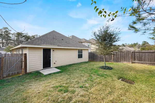 a view of a house with a yard and a garden
