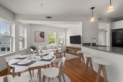 a view of a dining room with furniture