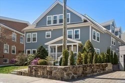 8 Dustin Street, Unit 103 Boston, MA 02135 - Photo 8 of 10 a front view of a house with a yard