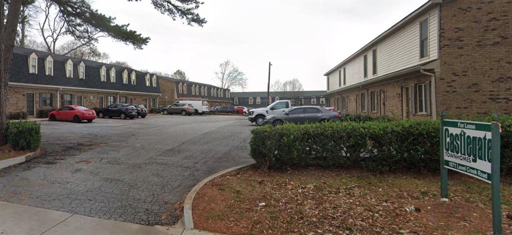 1071 Level Creek Road, Unit F Buford, GA 30518 - Photo 1 of 9 a view of a street with cars