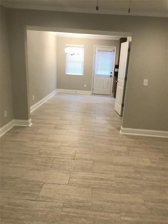 1071 Level Creek Road, Unit F Buford, GA 30518 - Photo 5 of 9 a view of a room with wooden floor