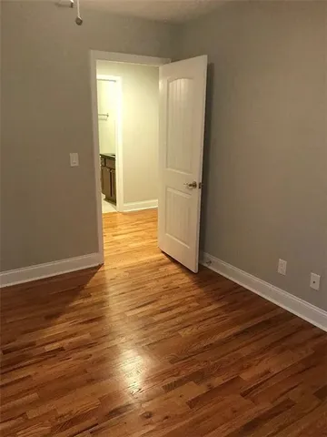 a view of wooden floor in an empty room