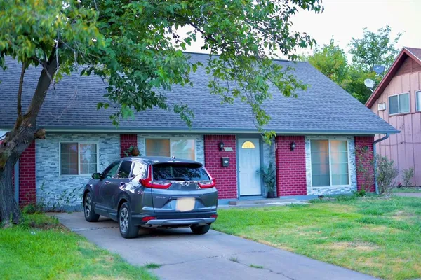 a car parked in front of a house