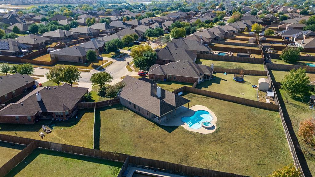 an aerial view of a house with swimming pool