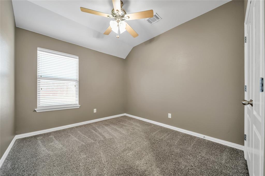 263 Archer Way Forney, TX 75126 - Photo 16 of 23 an empty room with windows and fan