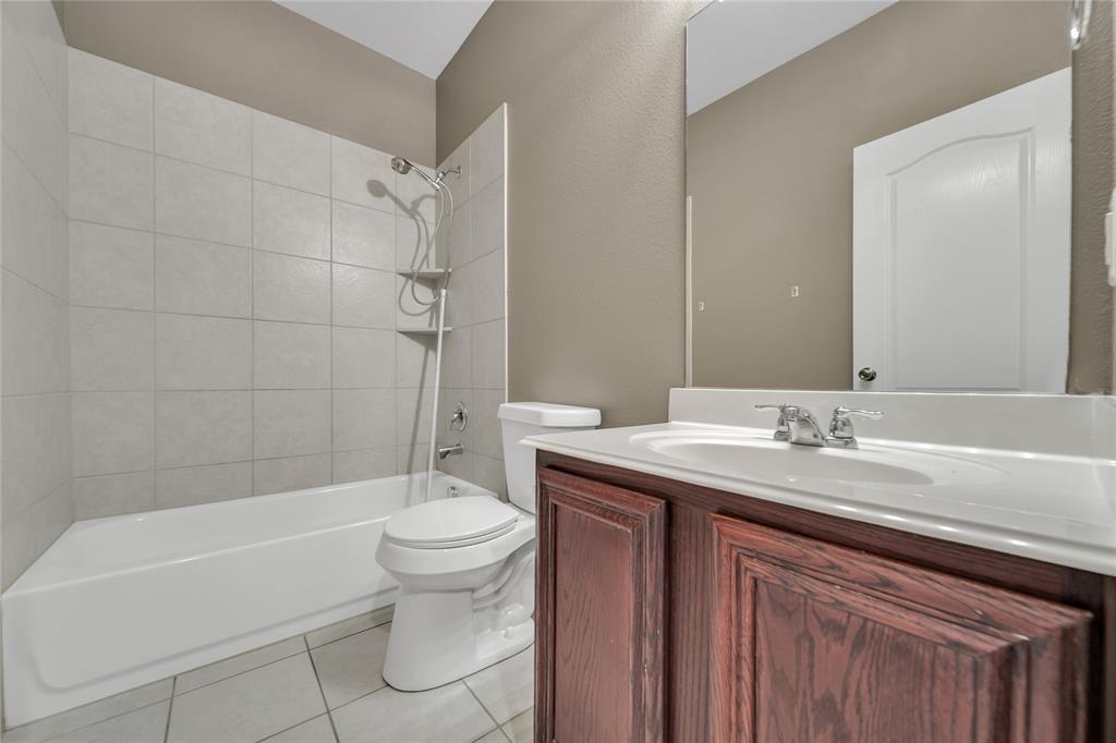 263 Archer Way Forney, TX 75126 - Photo 17 of 23 a bathroom with a sink a toilet and a bathtub
