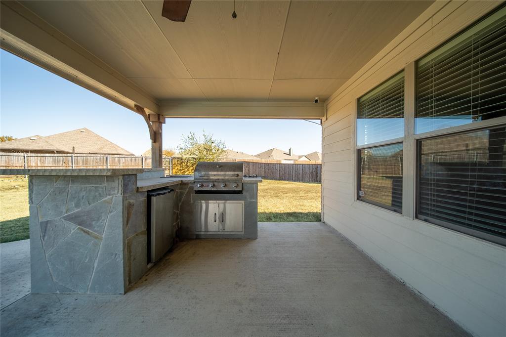 263 Archer Way Forney, TX 75126 - Photo 19 of 23 a view of a kitchen with a sink and dishwasher a oven with white cabinets