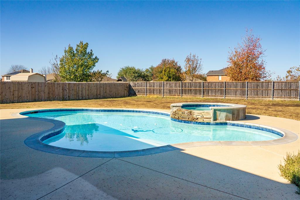 263 Archer Way Forney, TX 75126 - Photo 21 of 23 a view of a swimming pool with an outdoor space and seating area