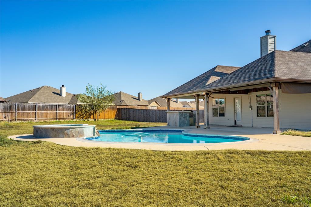 263 Archer Way Forney, TX 75126 - Photo 3 of 23 a view of a house with swimming pool and yard