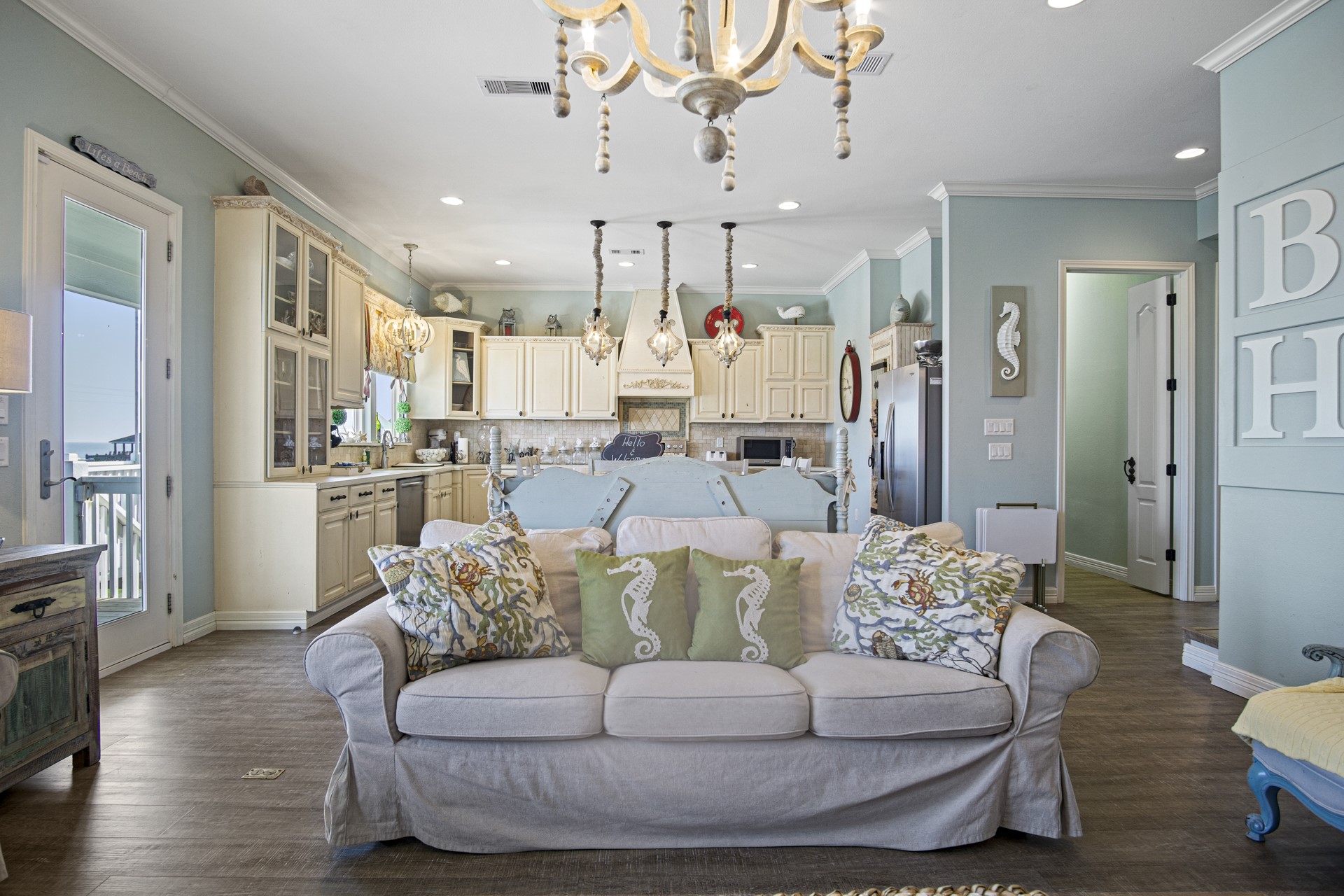 2573 Whitecap Crystal Beach, TX 77650 - Photo 16 of 49 a living room with furniture and a chandelier