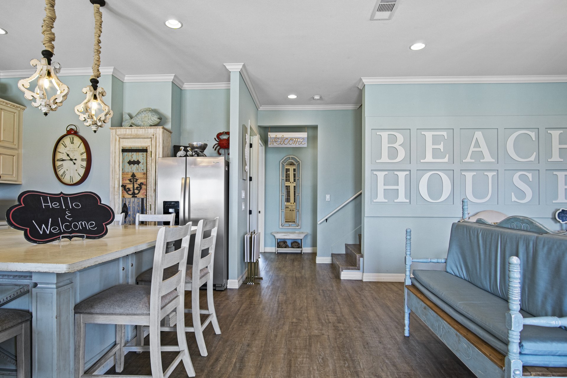 2573 Whitecap Crystal Beach, TX 77650 - Photo 20 of 49 a living room with furniture a clock and a view of kitchen