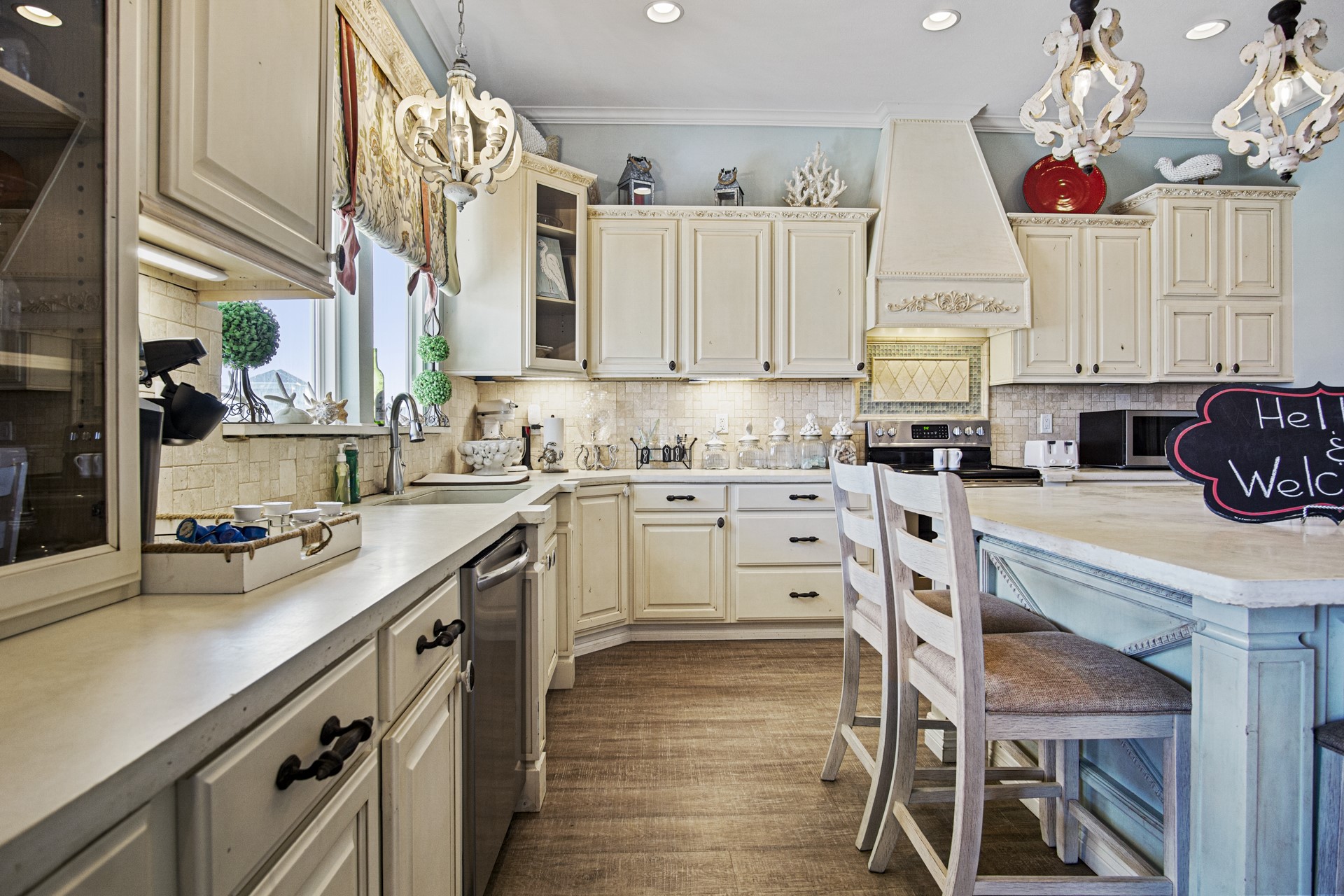 2573 Whitecap Crystal Beach, TX 77650 - Photo 21 of 50 a kitchen with a table chairs sink and cabinets