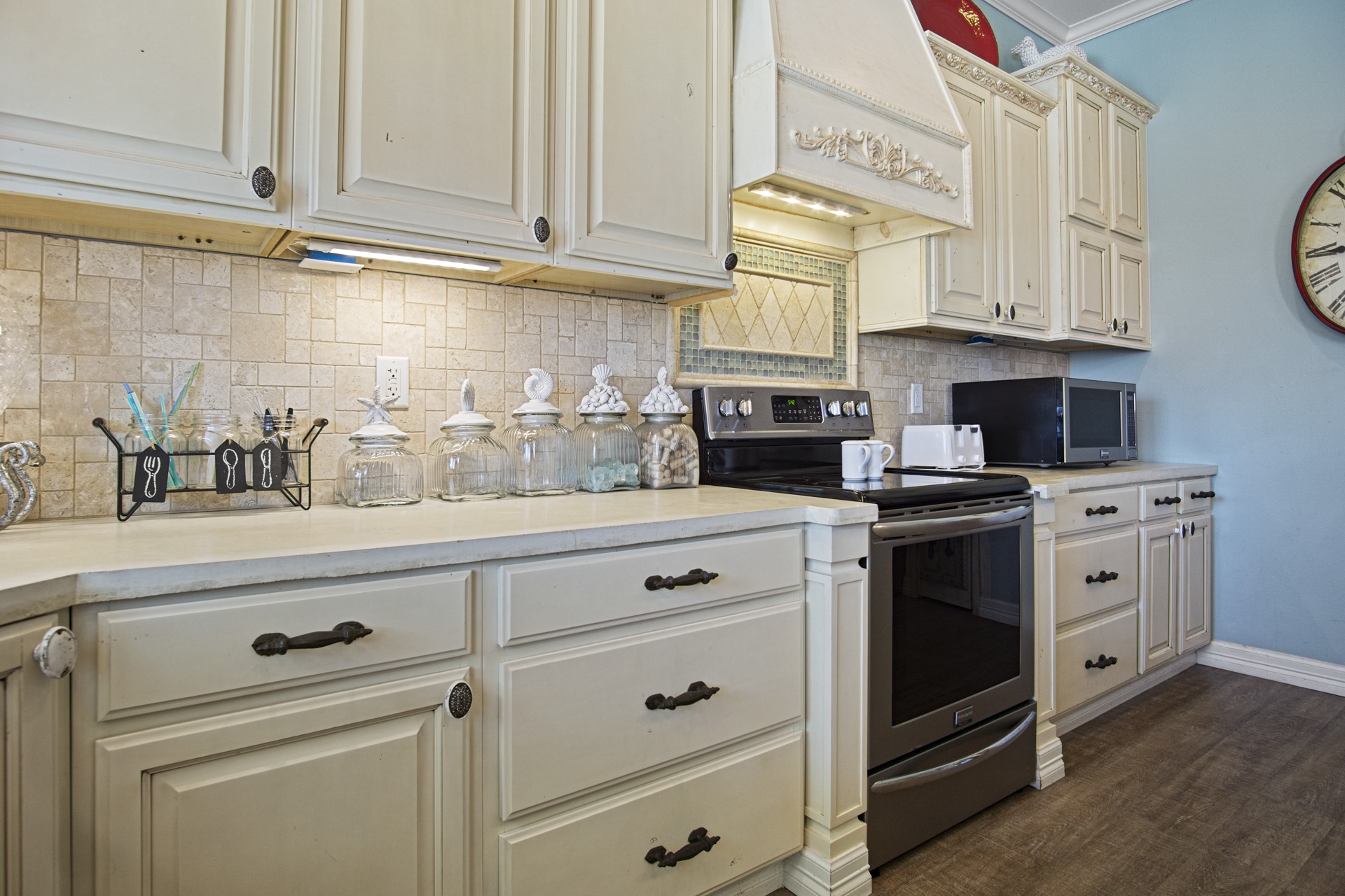 2573 Whitecap Crystal Beach, TX 77650 - Photo 23 of 50 a kitchen with stainless steel appliances white cabinets and a stove