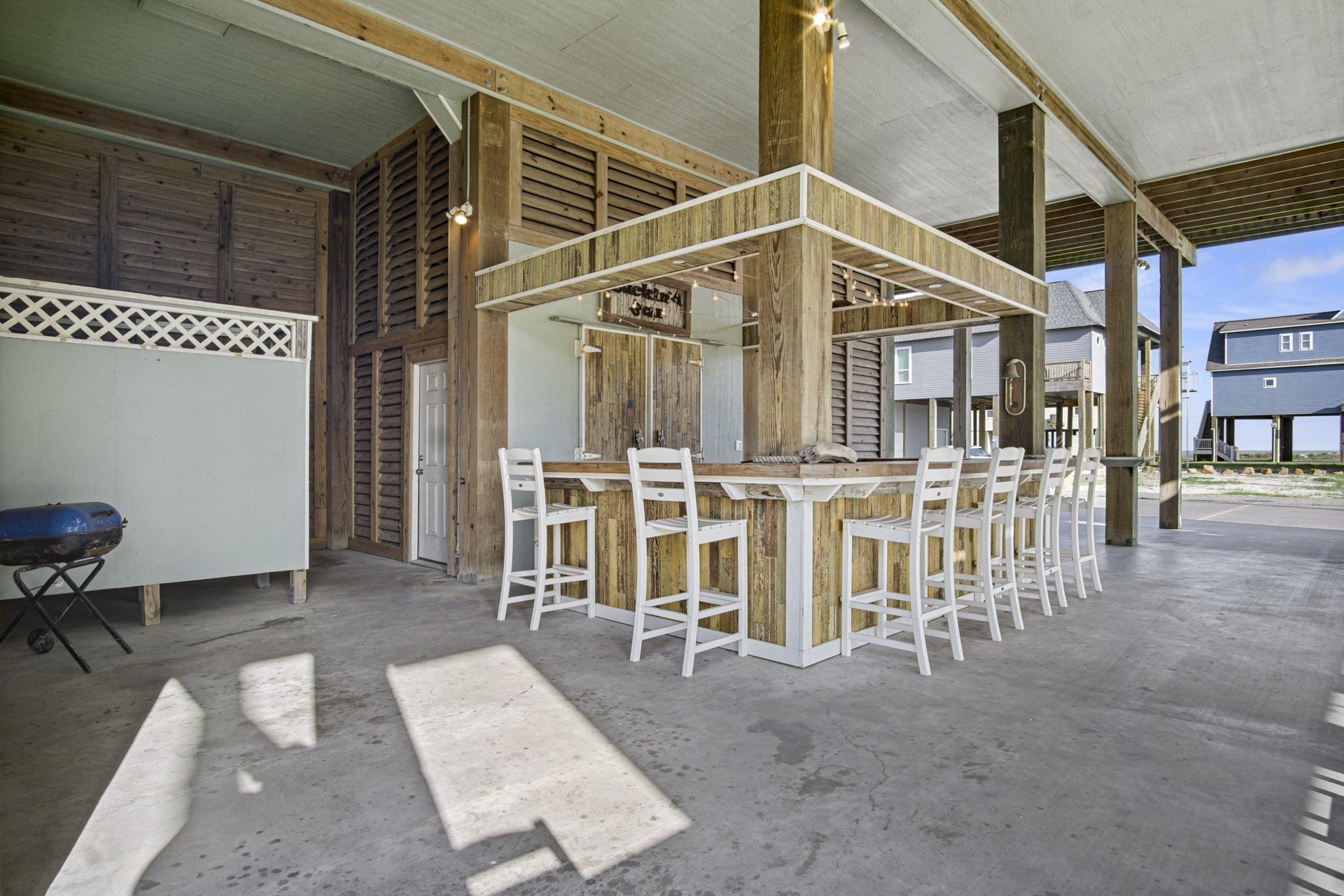 2573 Whitecap Crystal Beach, TX 77650 - Photo 3 of 49 a view of a house with table and chairs