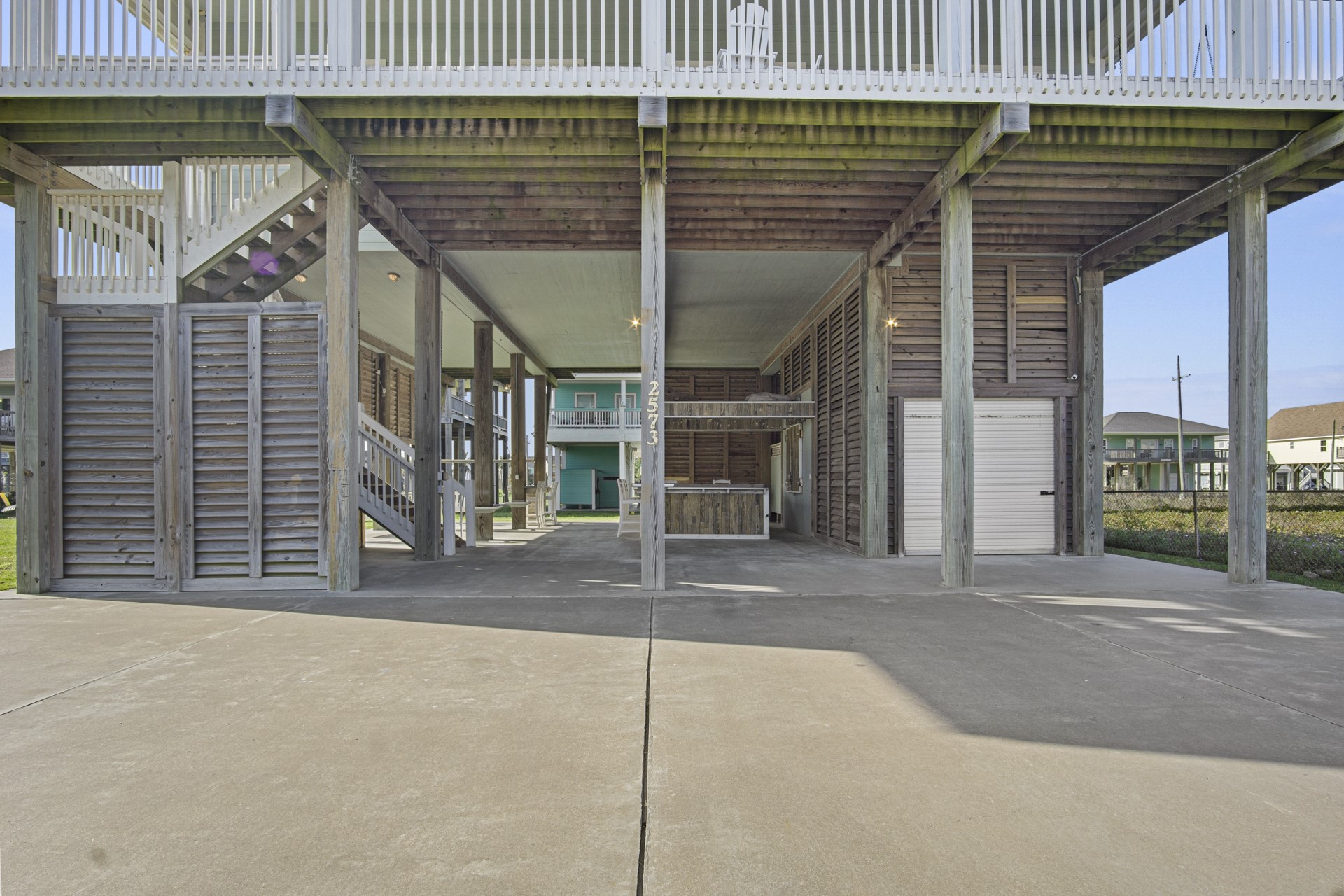 2573 Whitecap Crystal Beach, TX 77650 - Photo 3 of 50 a view of a house with a patio and a yard