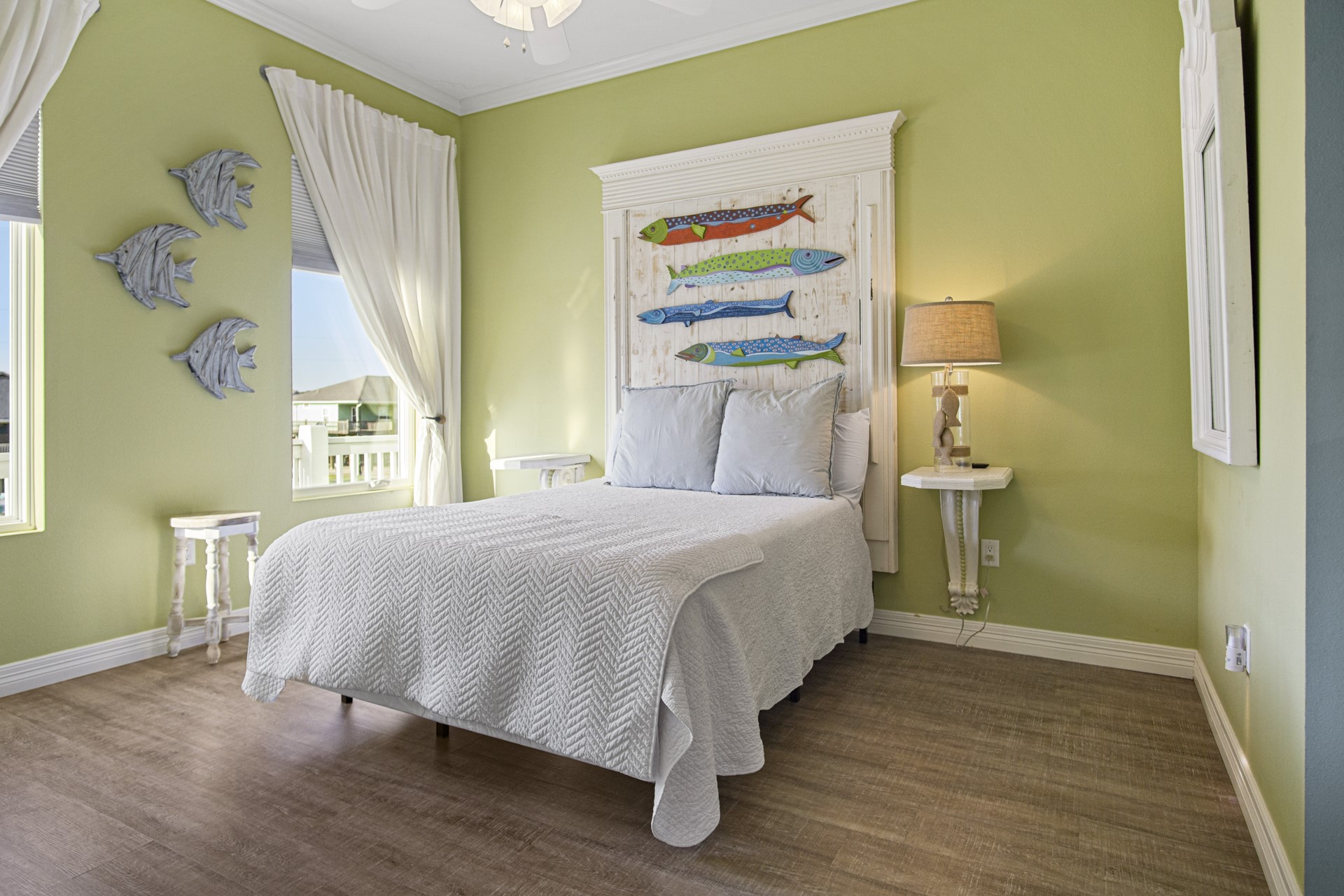 2573 Whitecap Crystal Beach, TX 77650 - Photo 31 of 50 a bedroom with a bed and a painting on the wall