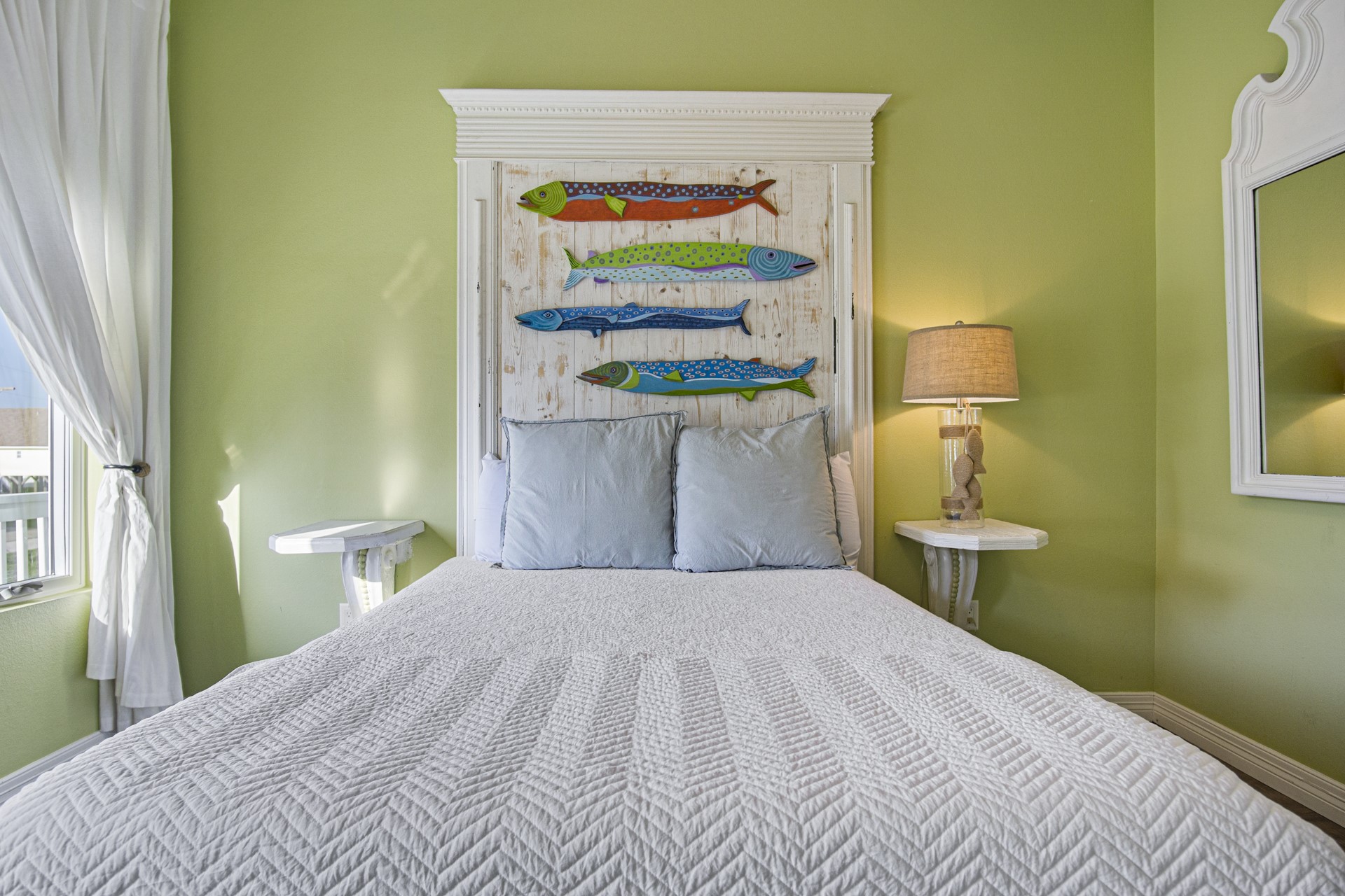 2573 Whitecap Crystal Beach, TX 77650 - Photo 32 of 50 a bedroom with a bed and painting on the wall