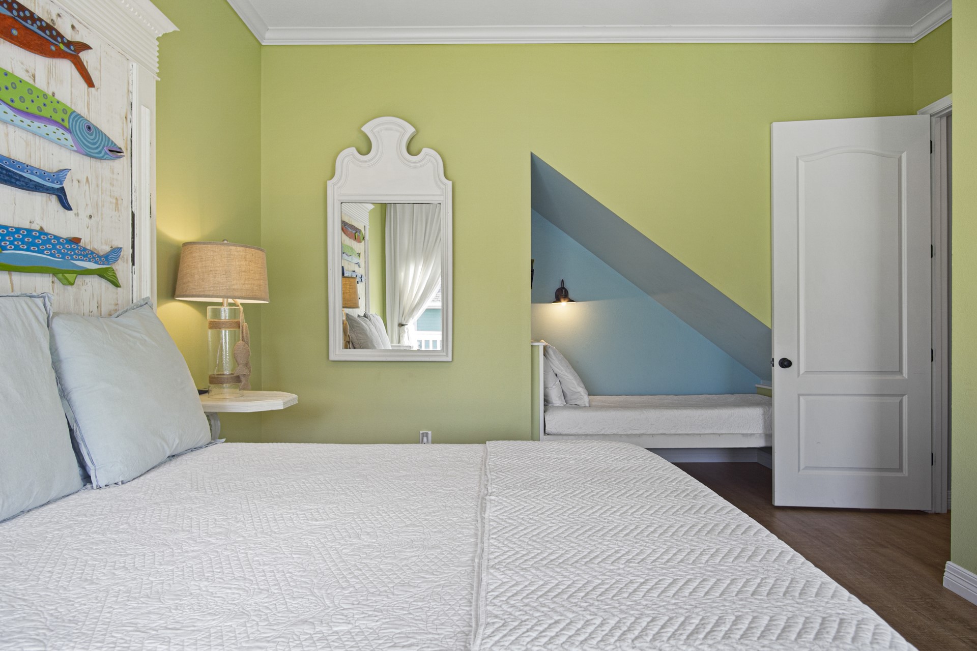 2573 Whitecap Crystal Beach, TX 77650 - Photo 33 of 50 a bedroom with a bed and a painting on the wall