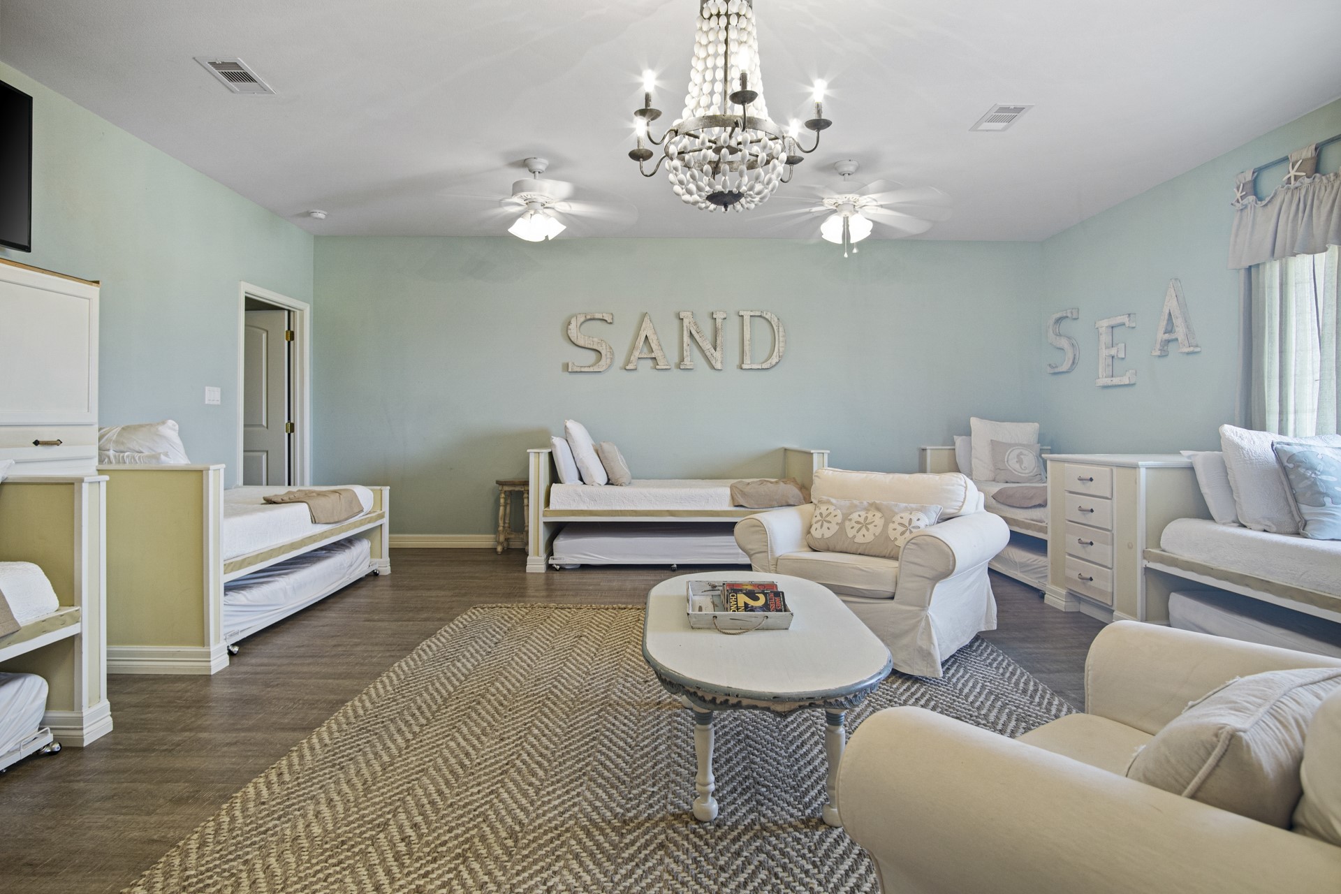 2573 Whitecap Crystal Beach, TX 77650 - Photo 34 of 50 a living room with furniture and a chandelier