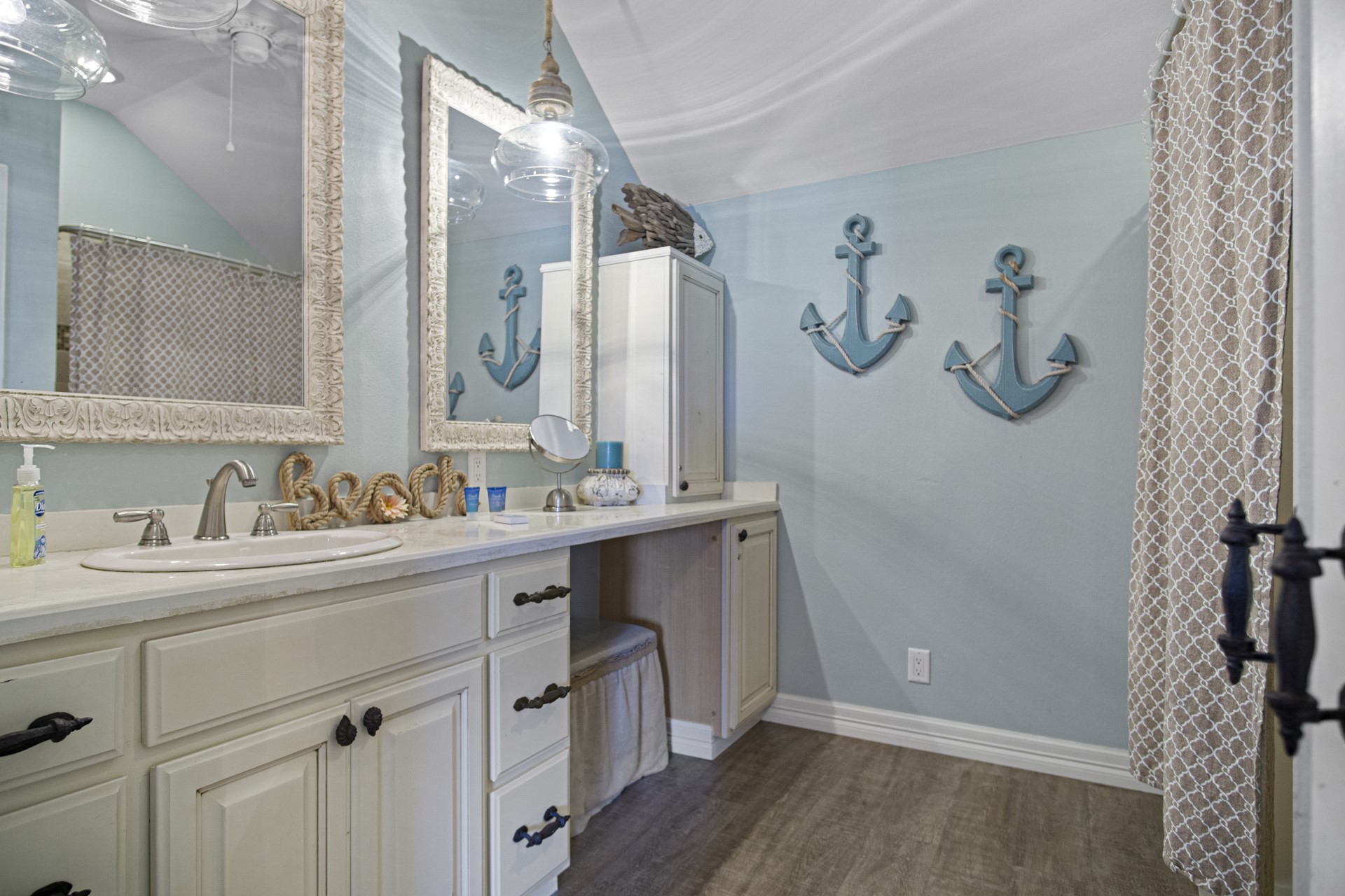 2573 Whitecap Crystal Beach, TX 77650 - Photo 36 of 50 a bathroom with a granite countertop sink and a mirror