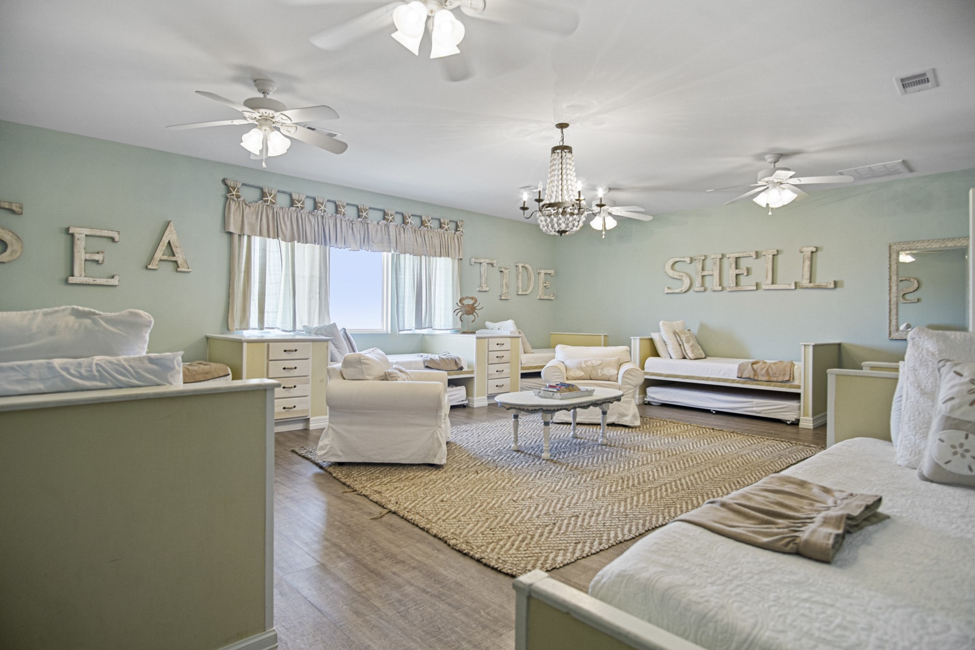 2573 Whitecap Crystal Beach, TX 77650 - Photo 38 of 50 a living room with furniture and a chandelier