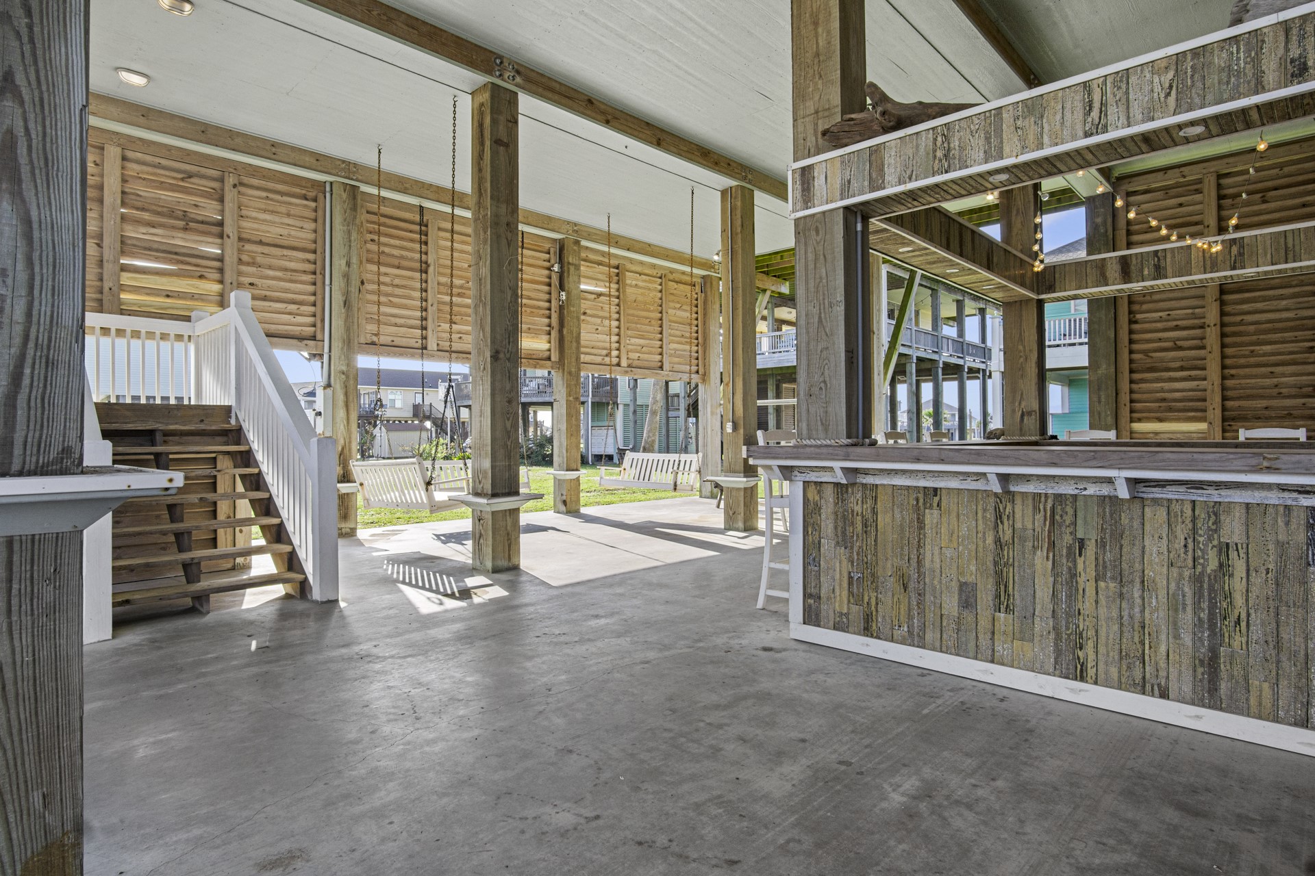 2573 Whitecap Crystal Beach, TX 77650 - Photo 4 of 50 a view of empty room with wooden floor and windows