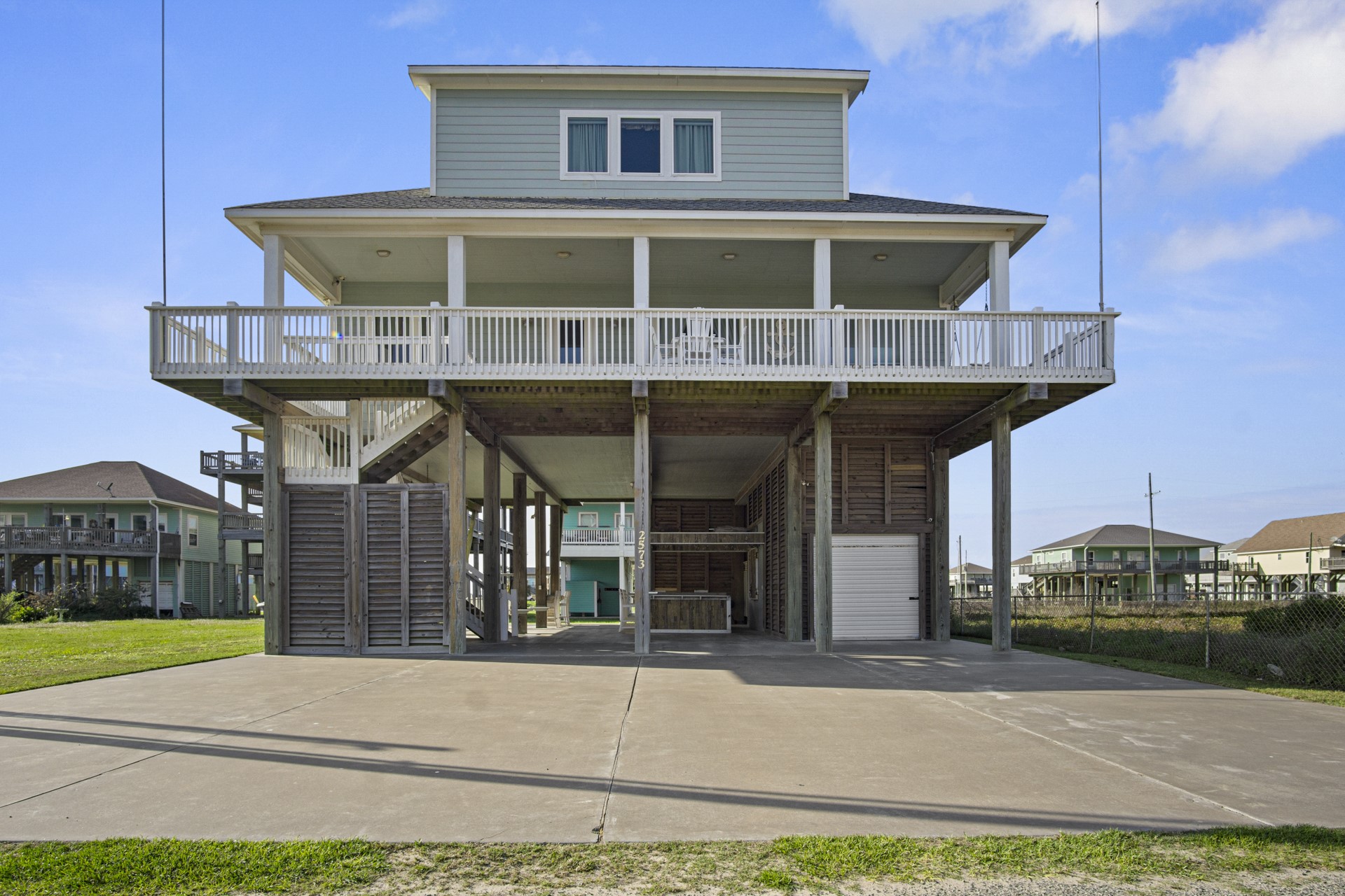 2573 Whitecap Crystal Beach, TX 77650 - Photo 4 of 49 a front view of a house with a yard