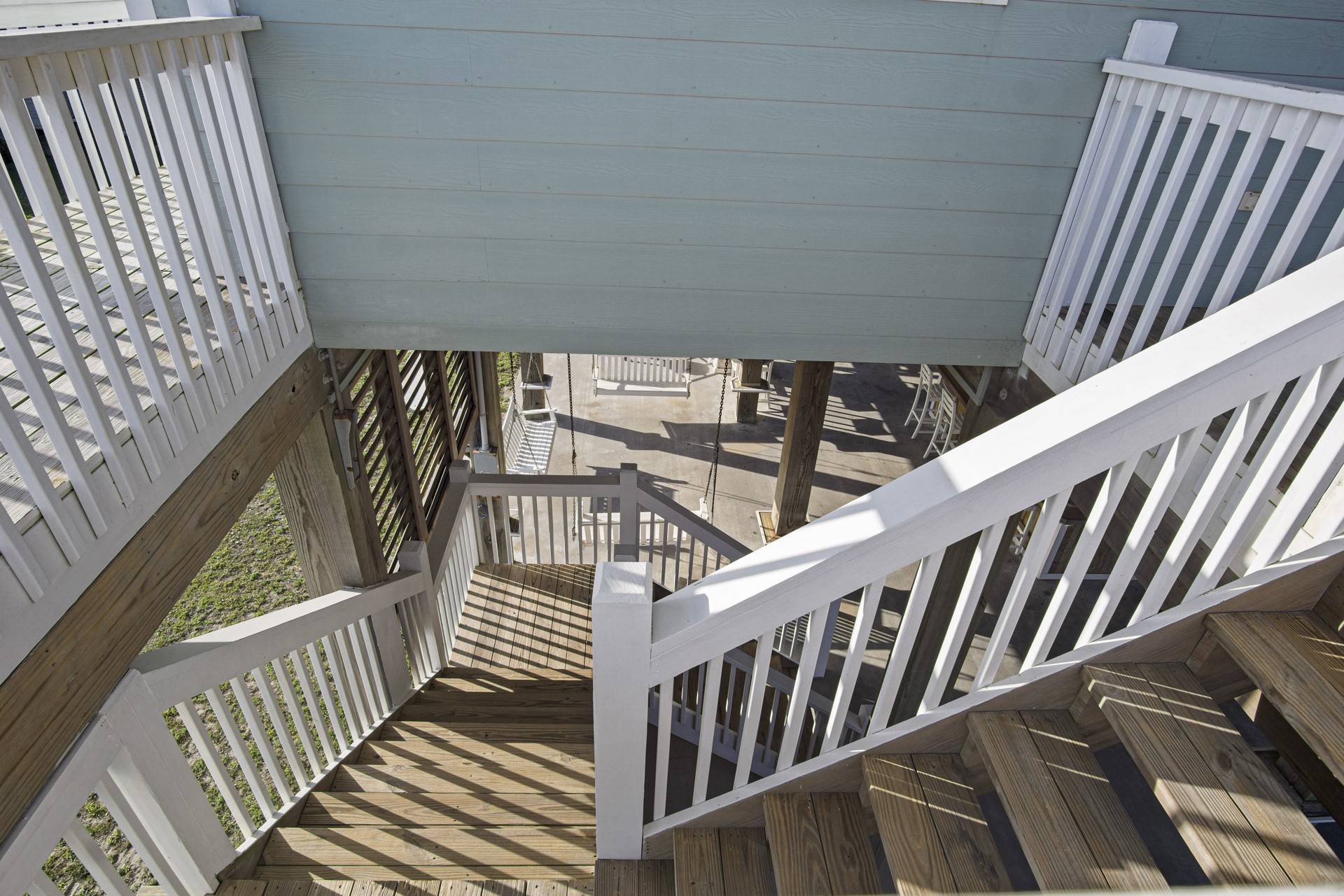 2573 Whitecap Crystal Beach, TX 77650 - Photo 43 of 49 a view of staircase with railing and white walls