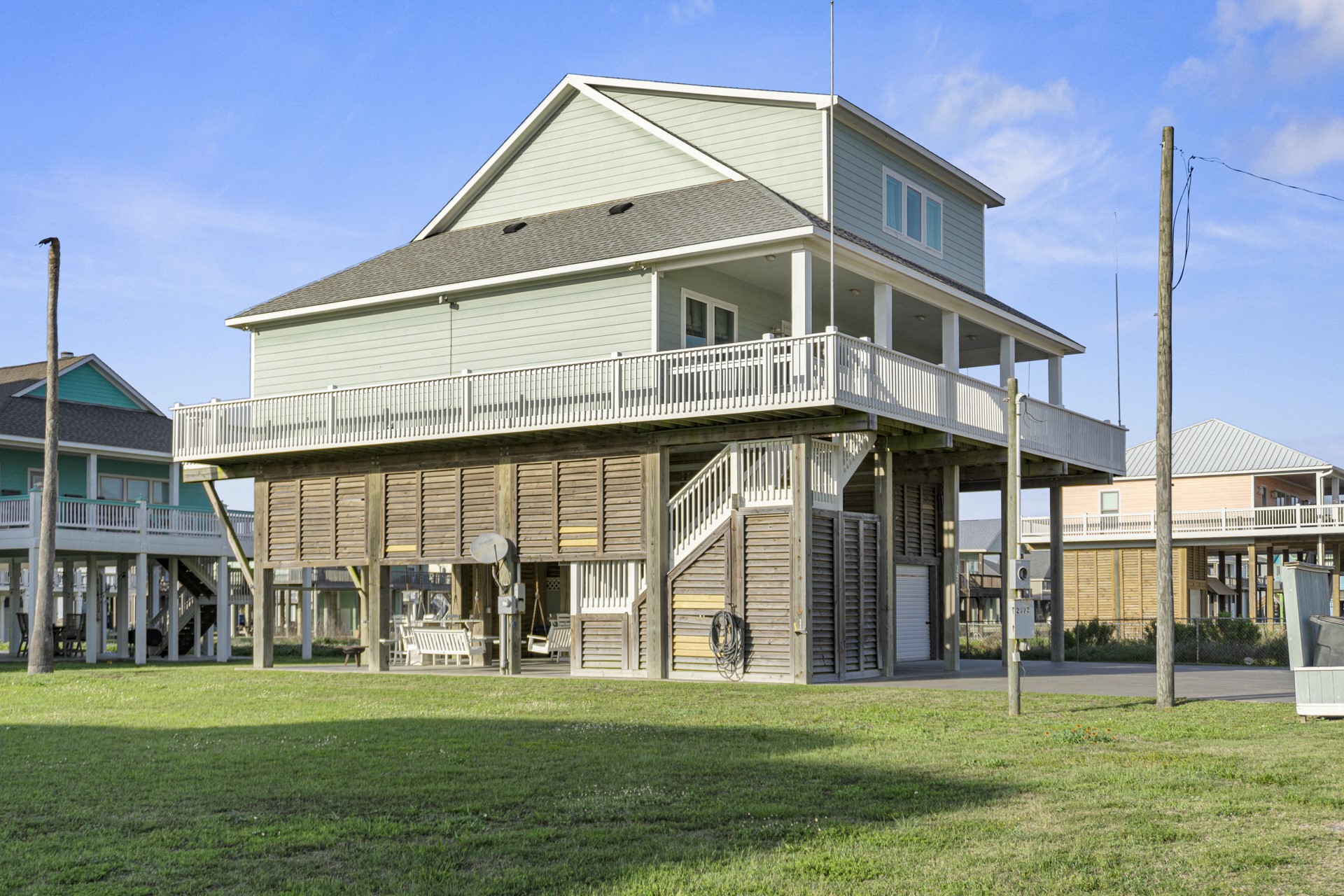 2573 Whitecap Crystal Beach, TX 77650 - Photo 48 of 50 a front view of a building with a garden