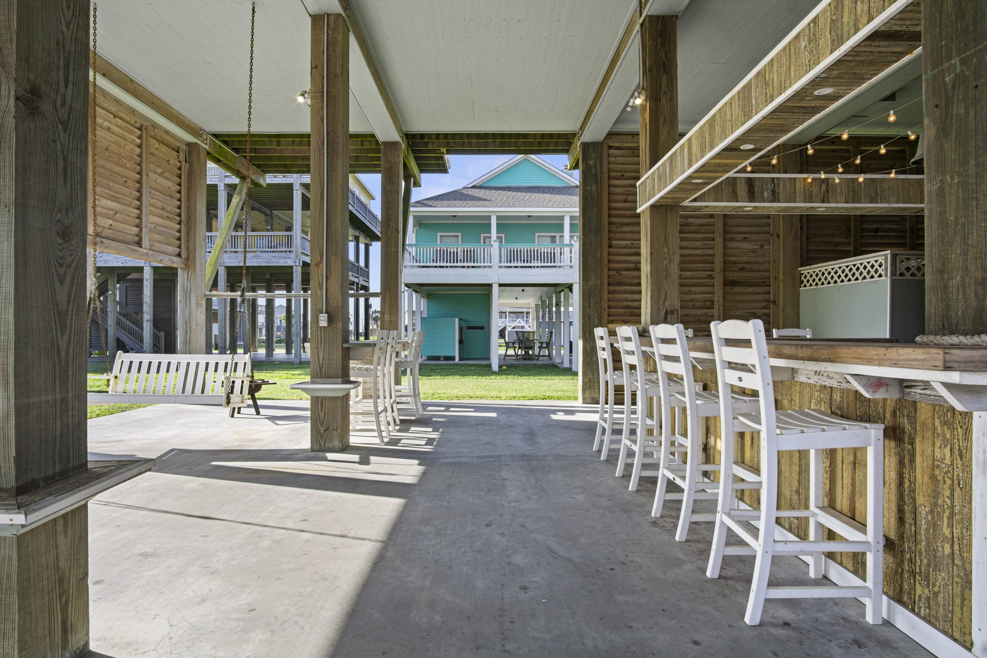 2573 Whitecap Crystal Beach, TX 77650 - Photo 5 of 50 a view of a house with a porch and furniture