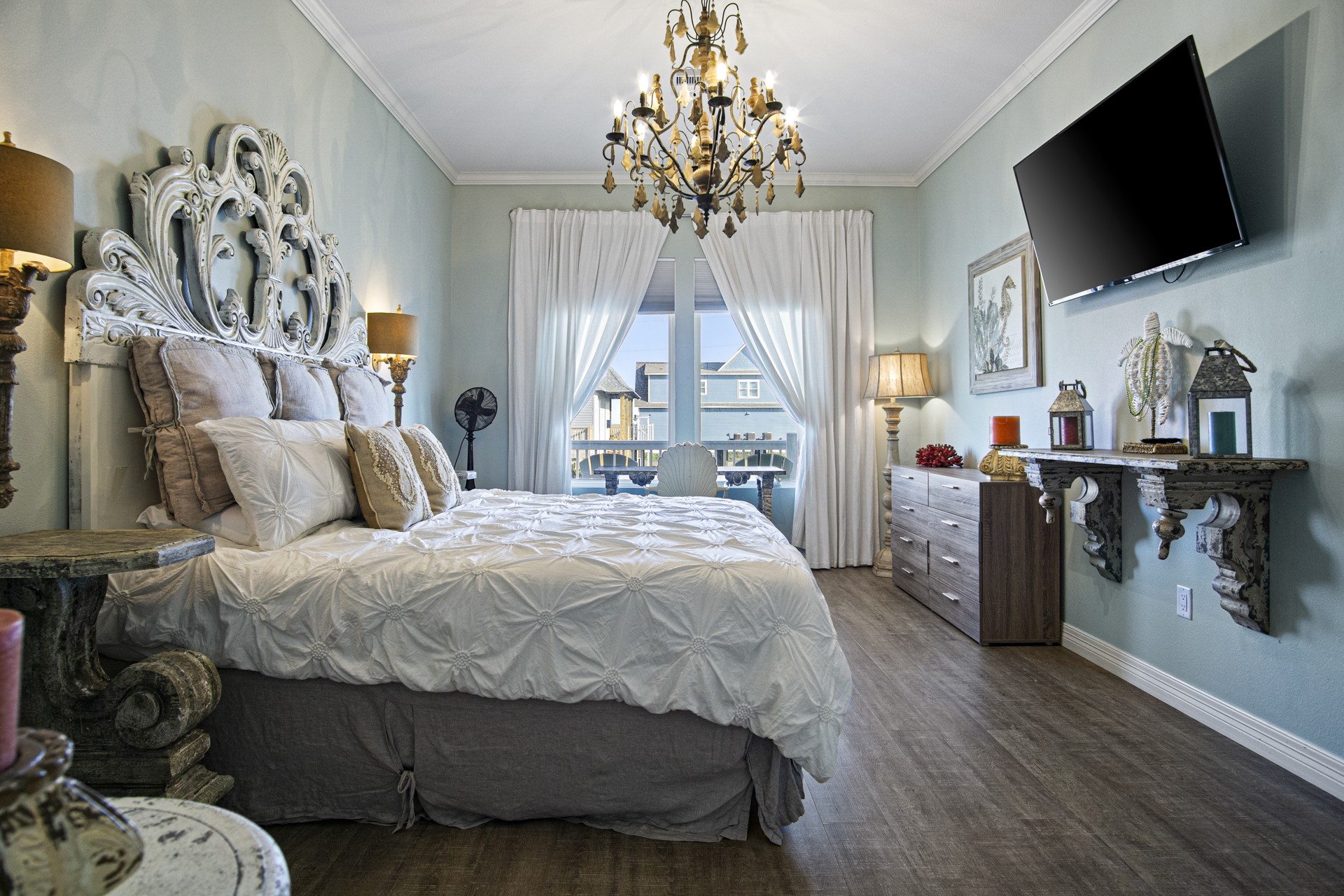 2573 Whitecap Crystal Beach, TX 77650 - Photo 10 of 49 a spacious bedroom with a bed and a flat screen tv