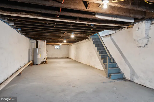 a view of an empty room with stairs