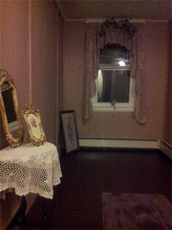 479 Main Street Hanson, MA 02341 - Photo 16 of 20 a bedroom with a bed and a mirror