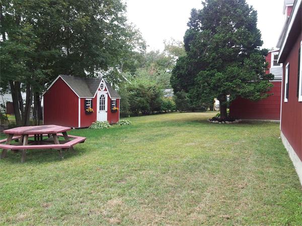 479 Main Street Hanson, MA 02341 - Photo 5 of 20 a view of a house with a yard and sitting area