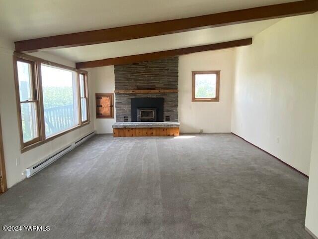 2451 Franklin Road Tieton, WA 98947 - Photo 2 of 15 a view of an empty room with a fireplace and a window