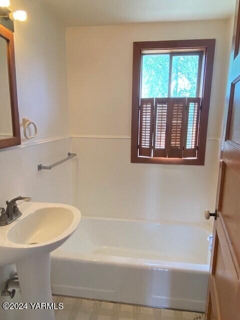 2451 Franklin Road Tieton, WA 98947 - Photo 6 of 15 a white bath tub sitting next to a white sink and a toilet
