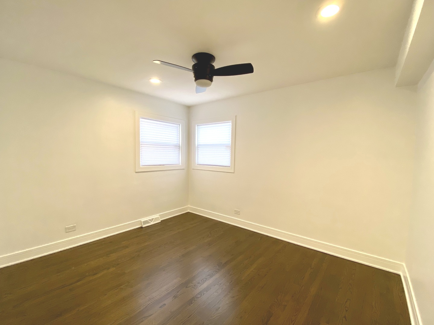 Undisclosed Address Chicago, IL 60617 - Photo 12 of 29 an empty room with wooden floor and windows