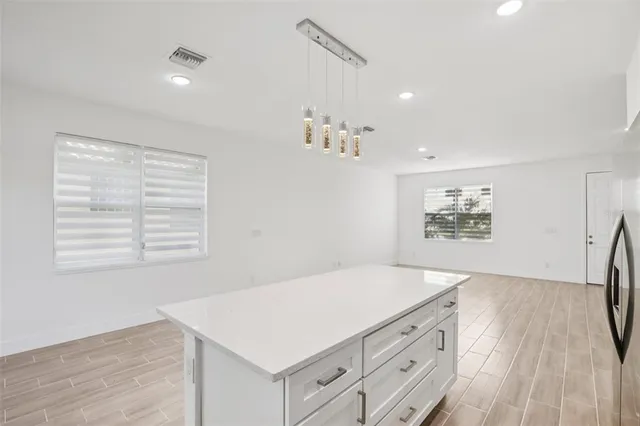 a room with a bed and a dresser