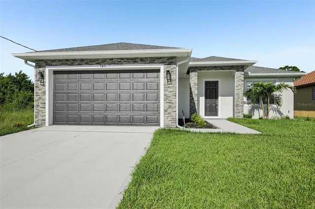 front view of a house with a yard