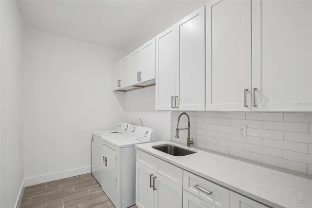 a kitchen with a sink and cabinets
