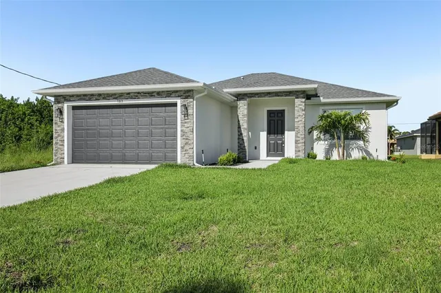 front view of a house with a yard