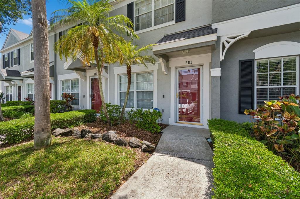 382 Countryside Key Boulevard Oldsmar, FL 34677 - Photo 2 of 58 a front view of a house with a porch
