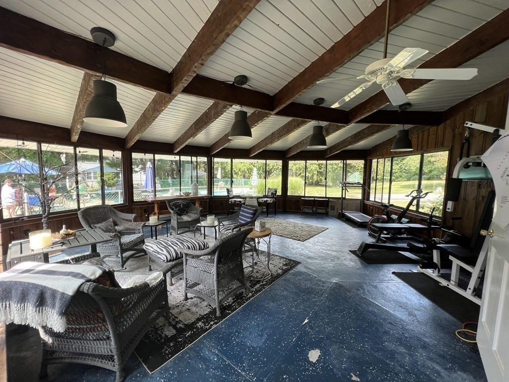 12 State Road, Unit 2E Plymouth, MA 02360 - Photo 28 of 28 a view of a patio with table and chairs a barbeque with wooden floor and roof with roof