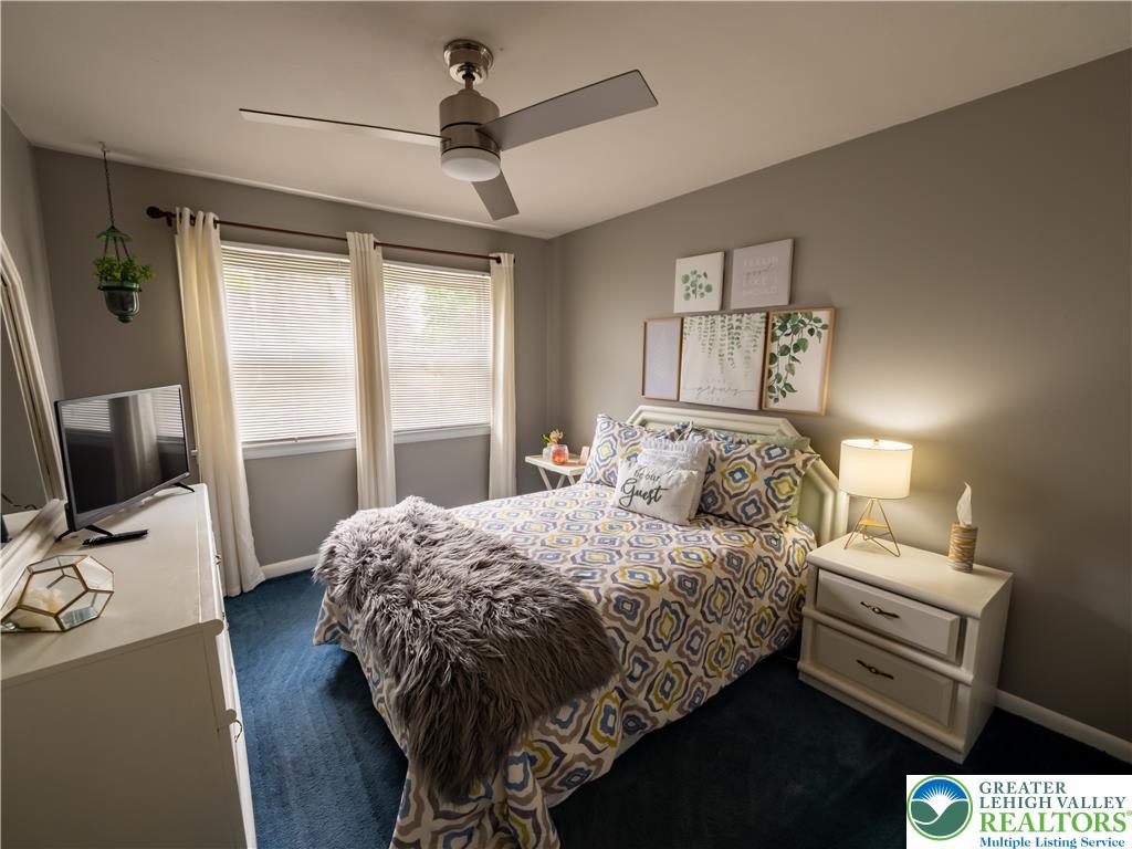 2087 Hopewell Road Bethlehem, PA 18017 - Photo 27 of 38 Relaxation awaits in this cozy bedroom, complete with a modern ceiling fan and ample natural light.