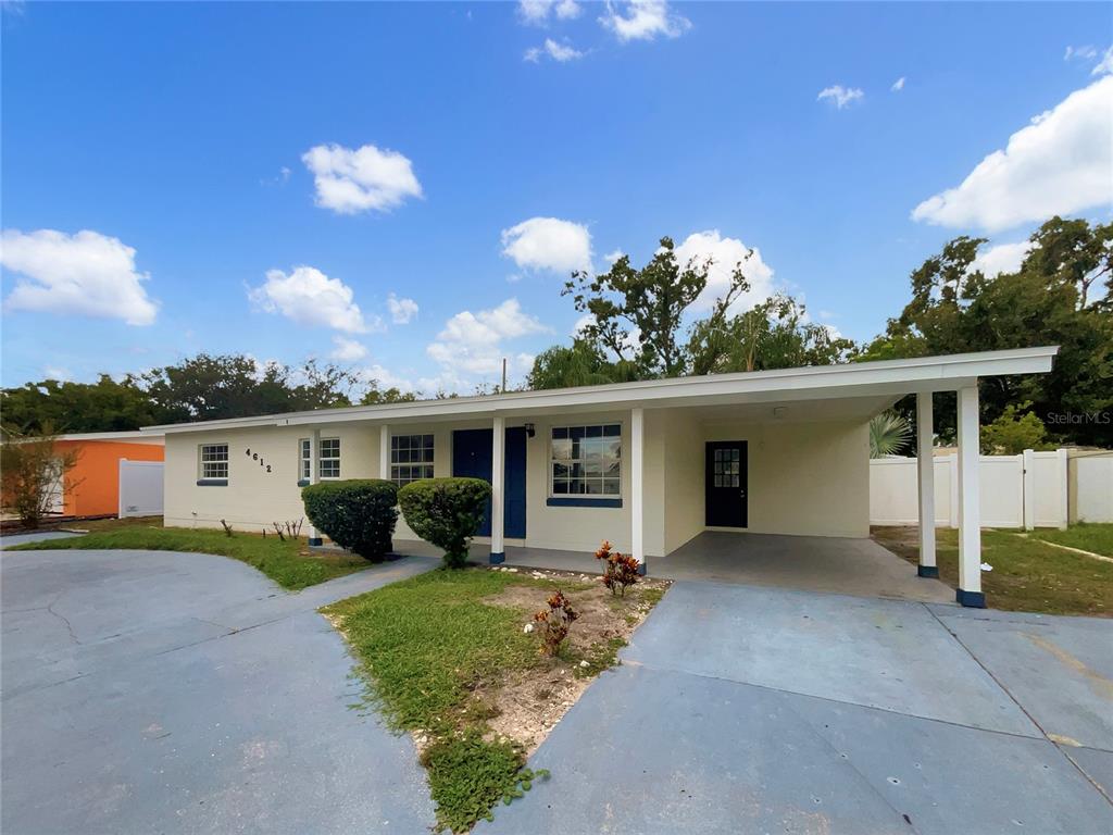 4612 Pompano Drive Tampa, FL 33617 - Photo 1 of 1 front view of a house with a yard