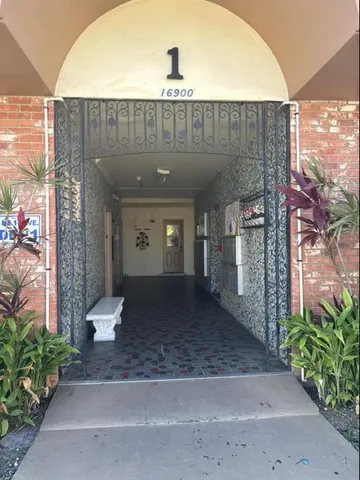 a view of a small room with wooden floor
