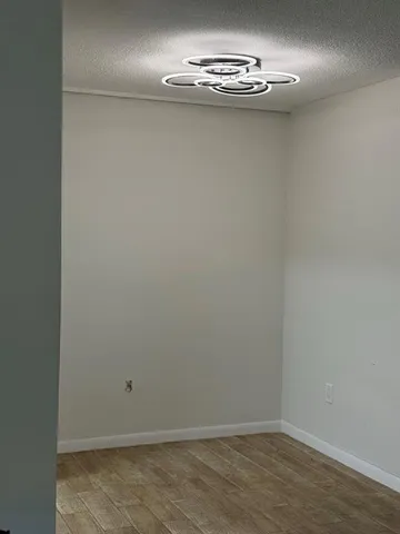an empty room with a chandelier